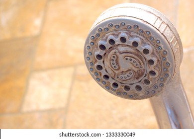 Hard water stain and rust on old shower tap in the bathroom. Sanitary, health care concept. Copy space for any text design.