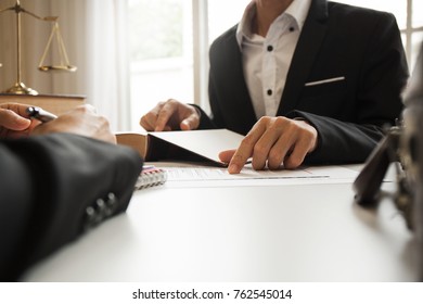 The hard work of an asian lawyer in a lawyer's office. Counseling and giving advice and prosecutions about the invasion of space between private and government officials to find a fair settlement. - Shutterstock ID 762545014