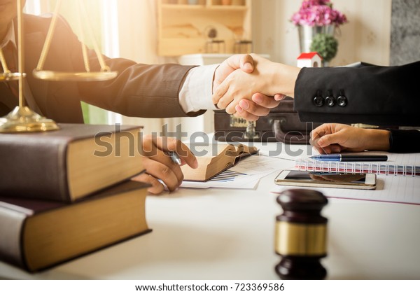 The hard work of an asian lawyer in a\
lawyer\'s office. Counseling and giving advice and prosecutions\
about the invasion of space between private and government\
officials to find a fair\
settlement.