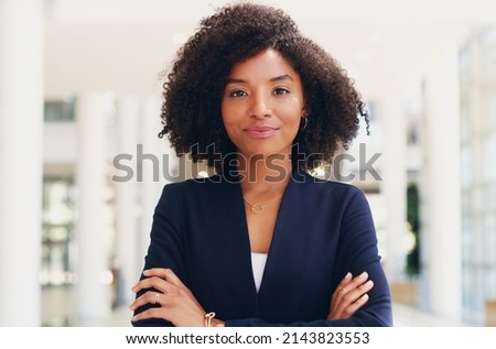 Hard work does not intimidate me. Cropped portrait of an attractive young businesswoman standing with her arms crossed while in the office during the day.