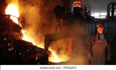 Hard Work In Foundry, Liquid Metal In The Foundry, Melting Iron In Furnace, Steel Mill. Workers Controlling Iron Smelting In Furnaces