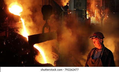 Hard Work In Foundry, Liquid Metal In The Foundry, Melting Iron In Furnace, Steel Mill. Workers Controlling Iron Smelting In Furnaces