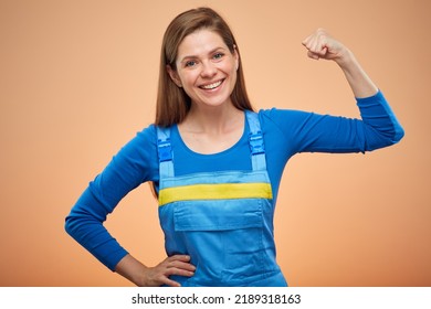 Hard Worker Woman In Overalls Flexing Arm. Woman Power Concept. Isolated Female Portrait.