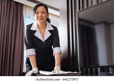 Hard Working Asian Hotel Maid Wiping The Dust