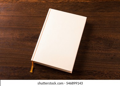 Hardcover Book on wood desk 