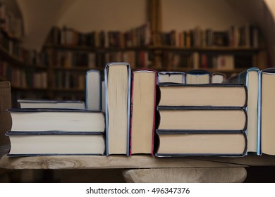 Hardcover Books Back Edges On Wooden Shelves Display Of Retail Book Store Or Shop Over Close Up