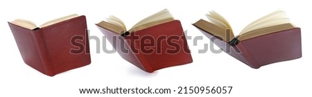 hardcover books flying on white background