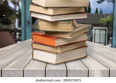 Hardcover Law Books Stacked On Wooden Table On Blur Room Background, Law Office, Pile Of Books