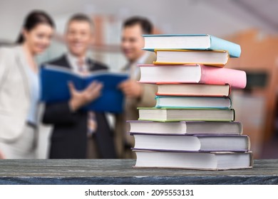 Hardcover Law Books Stacked On Wooden Table On Blur Room Background, Law Office, Pile Of Books