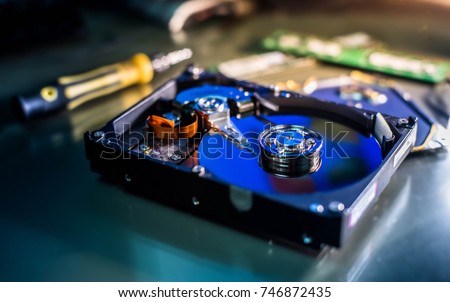 harddisk magnetic tape inside , open cover harddisk, A close up shot of harddisk