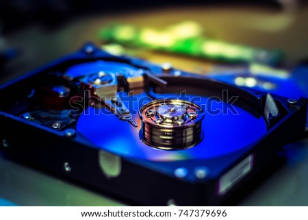 harddisk magnetic tape inside , open cover harddisk, A close up shot of harddisk