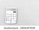 Hardened concrete and white calculator