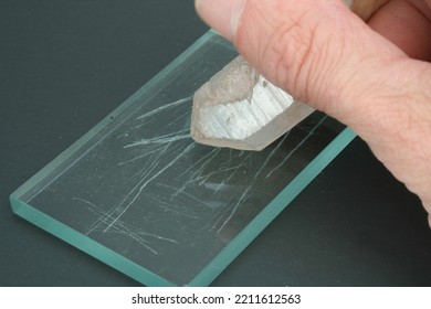 Hardness Test Of Quartz Crystal Being Scratched Against Glass Plate