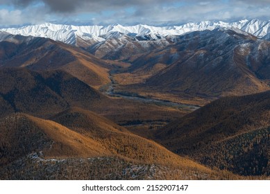 hard-to-reach areas. Taiga view from the helicopter. Autumn forest aerial photo. far east taiga view from helicopter. Winding forest river top view. wild siberian landscape. Hard-to-reach places.