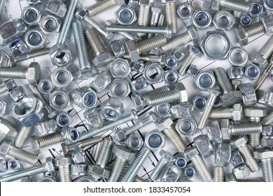 Hardware bolts and nuts top view background - Shutterstock ID 1833457054