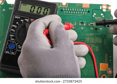 Hardware engineer testing electronic motherboard in service center