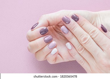 hardware manicure done in beauty salon  purple color gradient nails