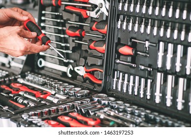 Hardware showcase. Cropped shot of repairman choosing screwdriver in tool store. - Shutterstock ID 1463197253