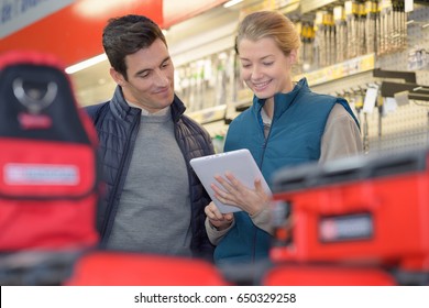 Hardwarer Store Worker With Craftsman Buyer