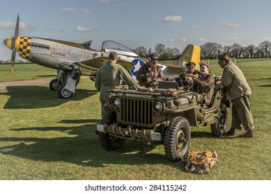 HARDWICK AIRFIELD, NORFOLK, UK - APRIL 18 - The airfield hosts a unique photographic event with restored military aircraft and volunteers reenacting scenes from WW2. 18 April 2015 in Norfolk.