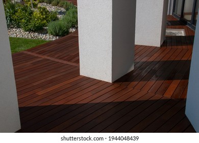 Hardwood Ipe Decking, A Freshly Painted And Stained Wood Deck On The Exterior Patio Of The Modern House Design