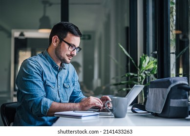 Hardworking executive, browsing the internet for information. - Shutterstock ID 2141433263