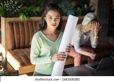 Hardworking students. Two students at cafe. Focus on foreground.