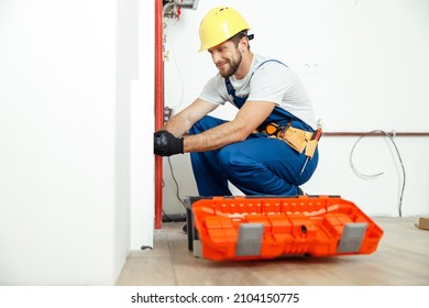 Hardworking Technician, Plumber In Uniform Using Tools From Toolbox While Installing And Checking Water Pipes