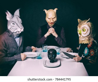 A Hare, Pig And Owl At A Dinner Table Serving Up A Human Head.