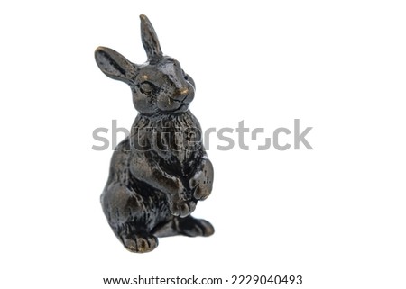 Hare Rabbit Vintage Antique grunge bronze brass figurine statue of beautiful animal, isolated on white background. Decoration Sculpture for interior. Copy Space for Text. Selective soft focus