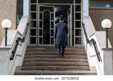 Haredi (Charedi) Orthodox Jewish Religious Man Entering Yeshiva.