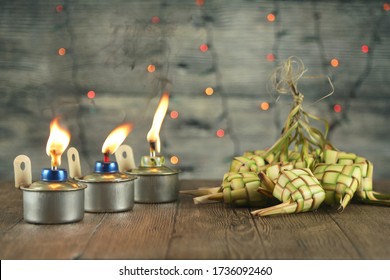 Hari Raya Aidilfitri Decoration Background With Pelita (oil Lamp Or Kerosene Lamp) And Ketupat (rice Dumplings). Out Of Focus.