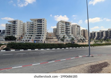 Harish, new city in Israel. Main street (boulevard). Construction site. Unfinished buildings. 