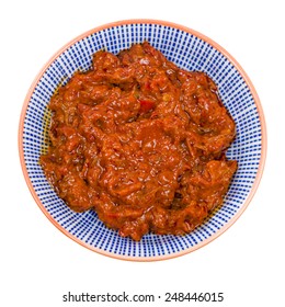 Harissa - Bowl Of Harissa Paste Isolated On A White Background.