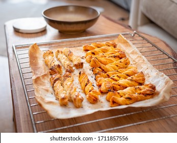 Harissa, Cheddar, Pepper, Za'atar, Ancho Chilli Flakes Puff Pastry Twists. After Baking. Side View Of Many. Party Food. 