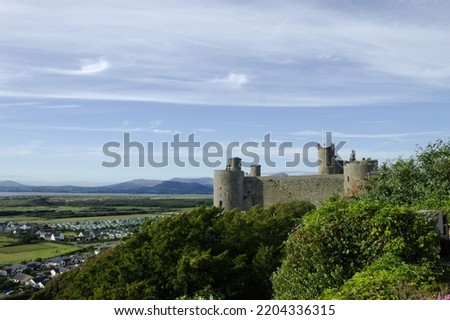Harlech Castle, Wales. Landscape view of a UNESCO monument.   Beautiful Welsh world heritage site.  Fortification of Edward 1 of England.  Blue sky and copy space. Stock photo © 