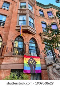 Harlem, NY, USA - October 14, 2020: A BLM Pride Flag Hangs Outside Of A Harlem Row House