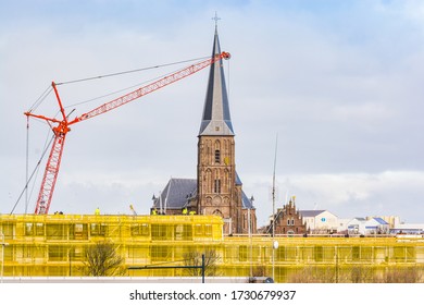 Harlingen, Netherlands - January 10, 2020. H. Aartsengel Michael Kerk - Church By The Water Canal In Winter.