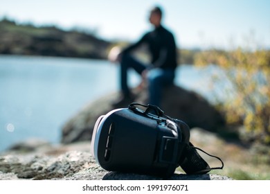 Harmful Effects Of Virtual Reality. Hidden Risk, Danger Of Virtual Reality. VR Headsets Bad For Health. Man Taking Off His VR Glasses And Enjoying Nature.