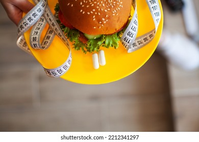 Harmful Fatty Burger With A Measuring Tape, Concept Diet