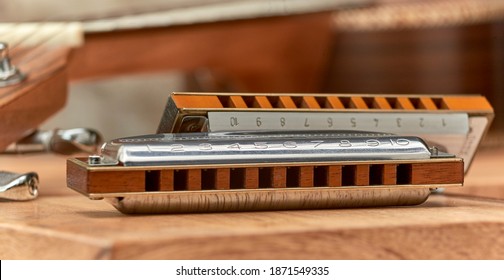Harmonica Blues - blues diatonic harp for playing country and Western.On light background.
