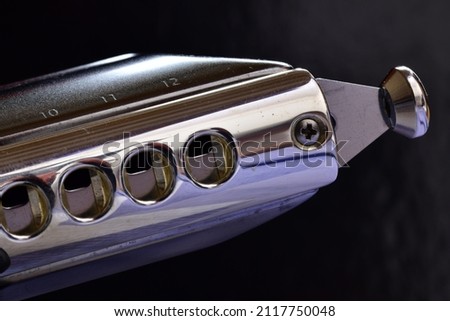 harmonica close up with dark back ground
