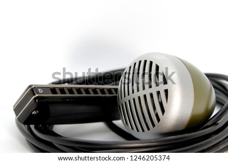 Harmonica and Microphone on a white background