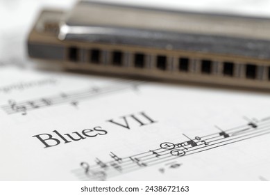 Harmonica and music notes in a close-up