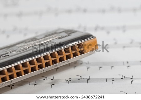 Harmonica and music notes in a close-up