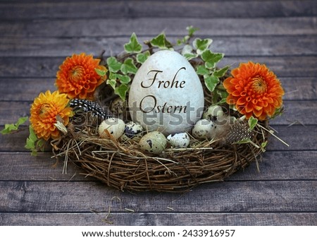 Harmonious Easter decoration with Easter eggs in a nest, one of which is labeled with the text Happy Easter. German inscription translates as Happy Easter.