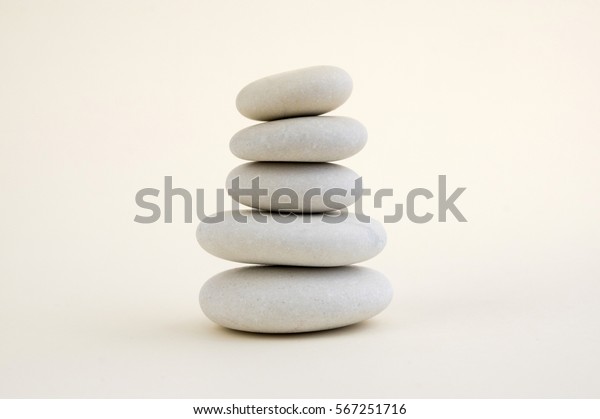 Harmony and balance, cairns, simple poise\
stones on white background, rock zen sculpture, five white pebbles,\
single tower,\
simplicity
