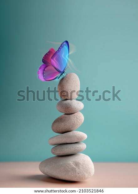 Harmony of\
Life Concept. Surrealist Butterfly on the Pebble Stone Stack.\
Metaphor of Balancing Nature and Technology. Calm, Mind, Life\
Relaxing and Living by Nature. Vertical\
image