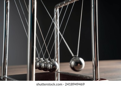 Harmony in Motion: Newton's Cradle Demonstrates the Beauty of Physics - Powered by Shutterstock