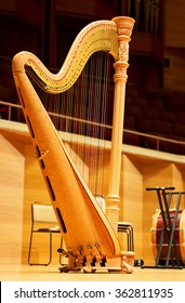 Harp In A Large Concert Hall. Musical Instrument.The Concert Harp